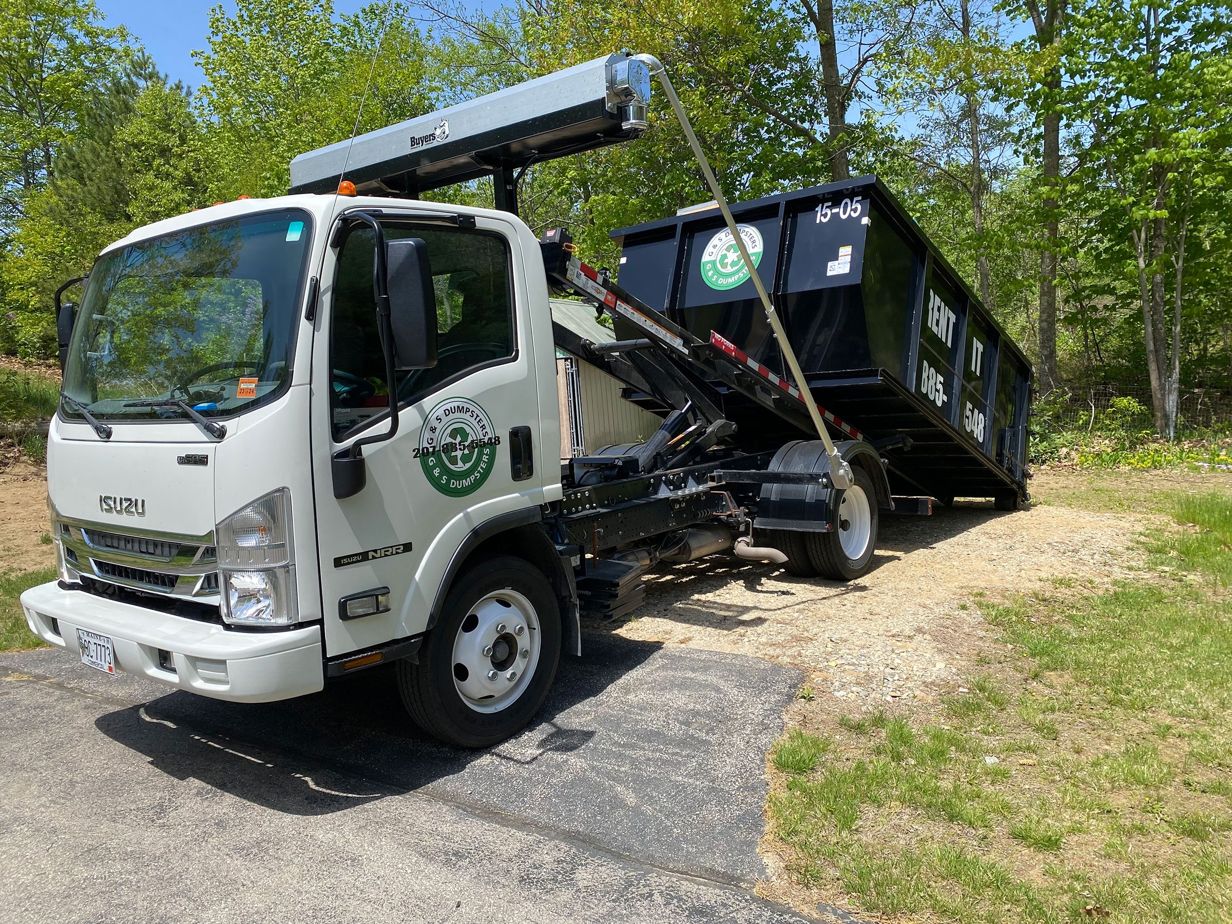 IMG_0889 dumpster being picked up angle 2